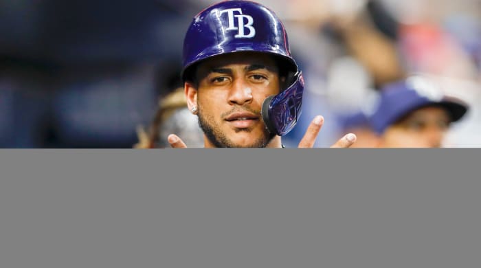 Aug 30, 2022; Miami, Florida, USA; Tampa Bay Rays center fielder Jose Siri (22) gestures in the dugout after scoring a run during the third inning against the Miami Marlins at loanDepot Park.